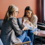 Practitioner supporting distressed patient