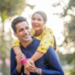 a man giving his female partner a piggy back ride